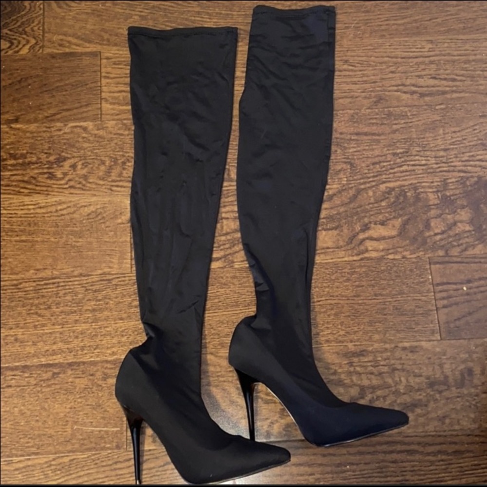 Thigh high Black Nylon Boots.